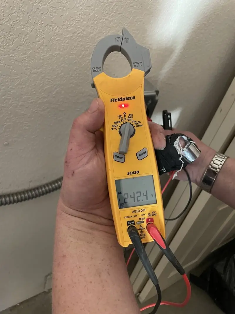 Voltage testing with clamp meter during Outlet Installation in Yuma
